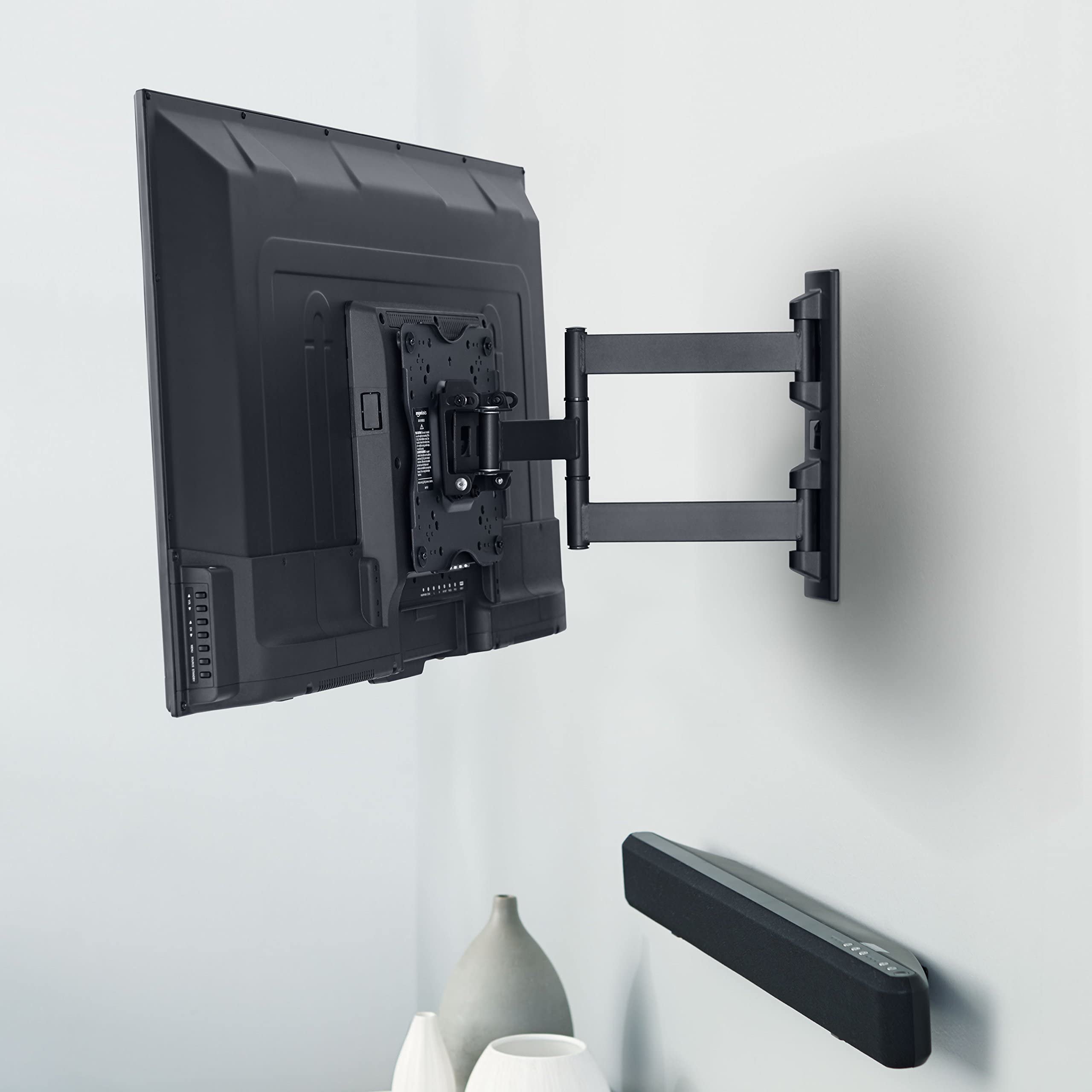 Amazon Basics TV Wall Bracket for 26-55 inch(66cm-140cm) TVs, Swivels Tilts TV Wall Mount for Flat & Curved TV, VESA 100x100mm to 400x400mm, holds up to 36kg, Black